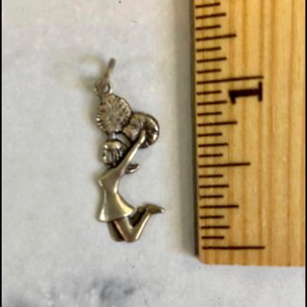 Vintage sterling silver cheerleader charm.